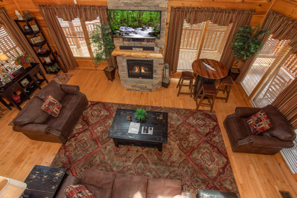 Looking down on the living room from the upper floor at Better View, a 4 bedroom cabin rental located in Pigeon Forge