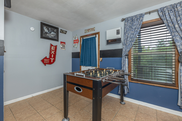 Foosball table in the game room at Bearing Views, a 3 bedroom cabin rental located in Pigeon Forge