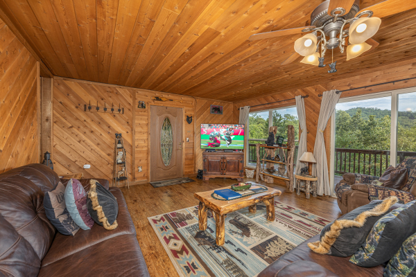 TV in a living room with mountain views at Bearing Views, a 3 bedroom cabin rental located in Pigeon Forge