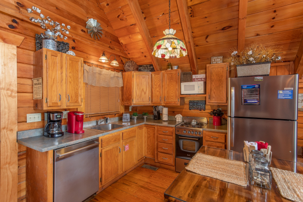 Kitchen with stainless appliances at Woodland Chalet, a 1 bedroom cabin rental located in Pigeon Forge