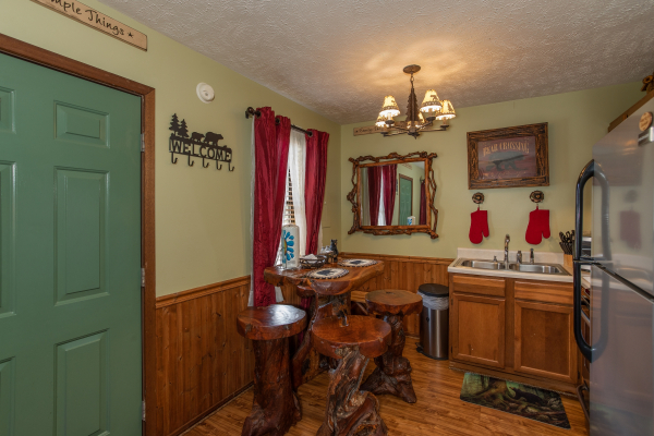 Dining space for four in the kitchen at Bear Mountain Hollow, a 1 bedroom cabin rental located in Pigeon Forge