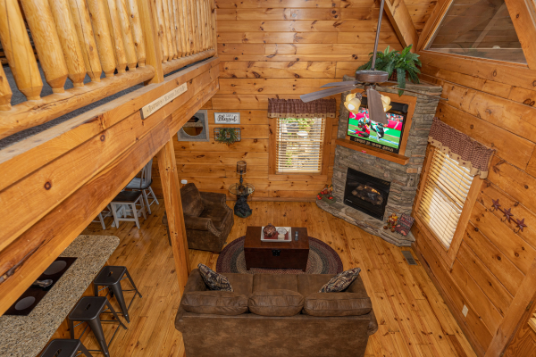 Looking down at the living room at Livin' Simple, a 2 bedroom cabin rental located in Pigeon Forge