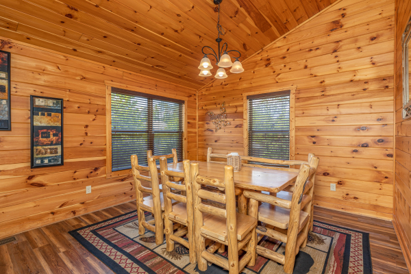 Dining table for eight at Pinot Paradise, a 3 bedroom cabin rental located in Pigeon Forge