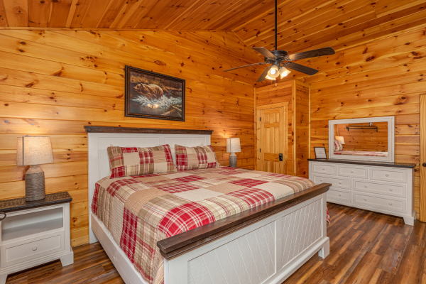 Bedroom with white furniture at Pinot Paradise, a 3 bedroom cabin rental located in Pigeon Forge