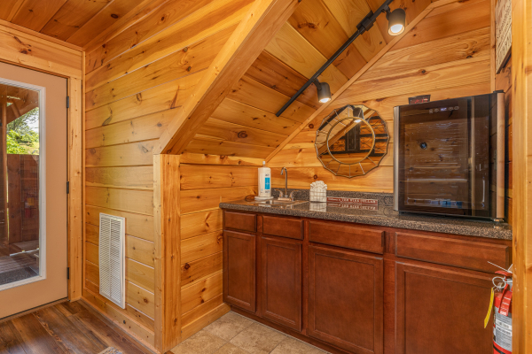 Kitchenette in the theater room at Pinot Paradise, a 3 bedroom cabin rental located in Pigeon Forge