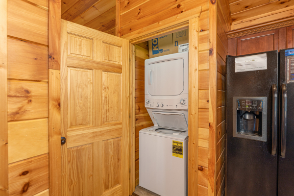 Stacked washer and dryer at Pinot Paradise, a 3 bedroom cabin rental located in Pigeon Forge