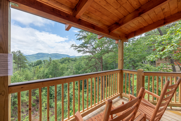 Rocking chairs and a mountain view at Sawmill Springs, a 3 bedroom rental cabin in Pigeon Forge