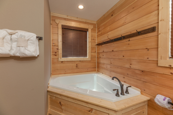 Corner jacuzzi tub at Sawmill Springs, a 3 bedroom cabin rental located in Pigeon Forge