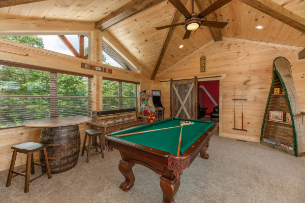 Game room with pool table and arcade game at Sawmill Springs, a 3 bedroom rental cabin in Pigeon Forge