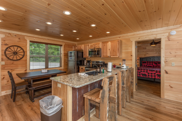 Breakfast bar and kitchen at Sawmill Springs, a 3 bedroom cabin rental located in Pigeon Forge