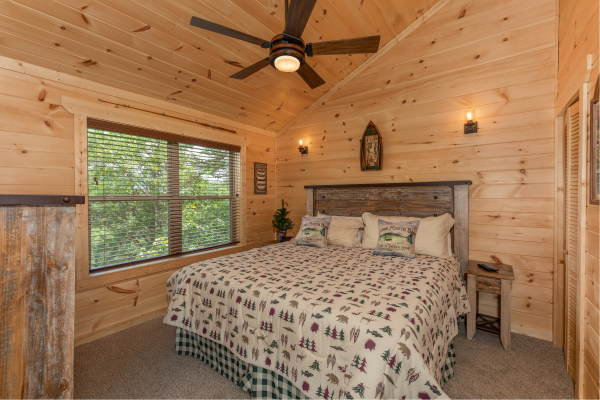 Bedroom with a king bed at Sawmill Springs, a 3 bedroom rental cabin in Pigeon Forge