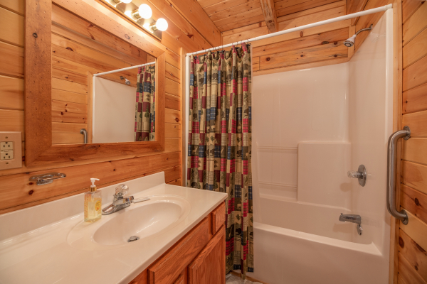 Bathroom with a tub and shower at Grand View, a 3 bedroom cabin rental located in Sevierville