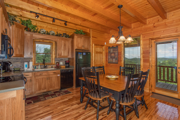 Dining table for 6 in the kitchen at Mountain Adventure, a 2 bedroom cabin rental located in Pigeon Forge