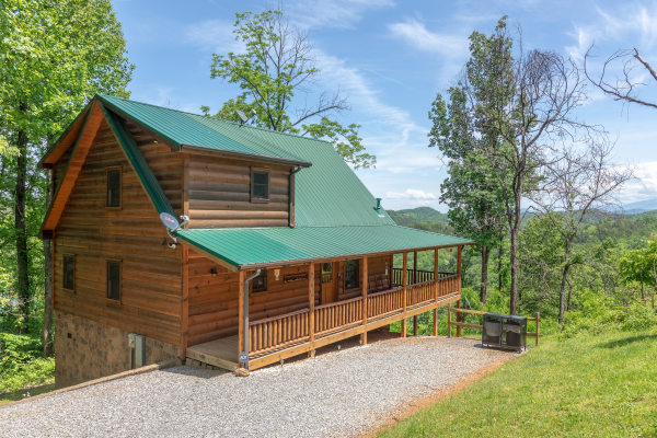 Driveway and cabin exterior at Mountain Adventure, a 2 bedroom cabin rental located in Pigeon Forge