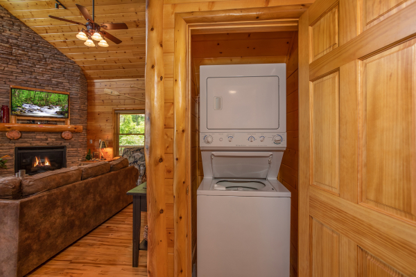 Stacked washer and dryer in a closet at Mountain Adventure, a 2 bedroom cabin rental located in Pigeon Forge