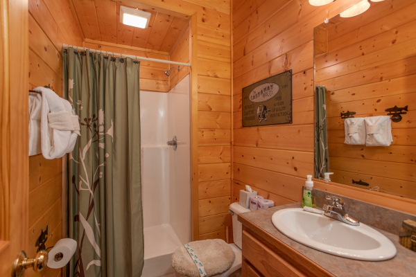Bathroom with a walk in shower at Mountain Adventure, a 2 bedroom cabin rental located in Pigeon Forge