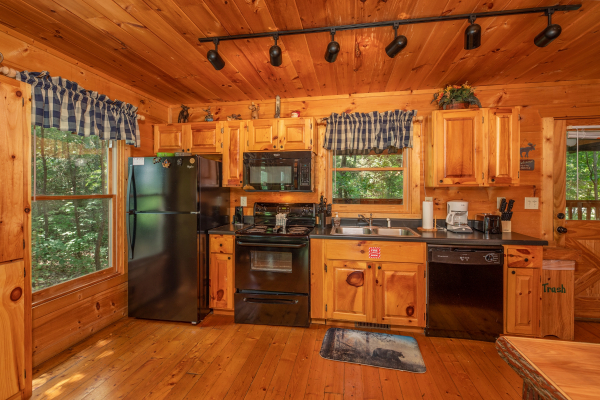 Kitchen with black appliances at Misty Mountain Escape, a 2 bedroom cabin rental located in Gatlinburg