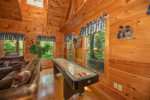 Shuffleboard game at Misty Mountain Escape, a 2 bedroom cabin rental located in Gatlinburg