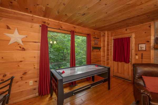 Air hockey table at Logan's Smoky Den, a 2 bedroom cabin rental located in Pigeon Forge