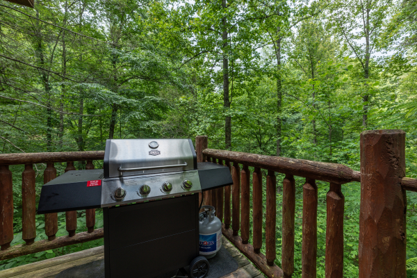 Grill on the deck at Logan's Smoky Den, a 2 bedroom cabin rental located in Pigeon Forge