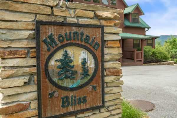Custom sign at Mountain Bliss, a 2 bedroom cabin rental located in Pigeon Forge