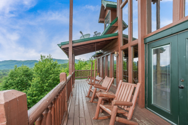 Log rockers on the deck at Mountain Bliss, a 2 bedroom cabin rental located in Pigeon Forge