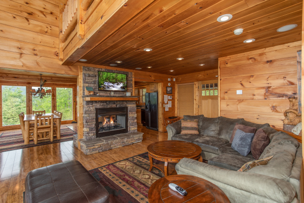 Fireplace and TV in the living room at Mountain Bliss, a 2 bedroom cabin rental located in Pigeon Forge