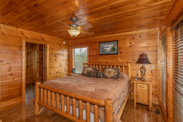 Bedroom with a log bed at Mountain Bliss, a 2 bedroom cabin rental located in Pigeon Forge