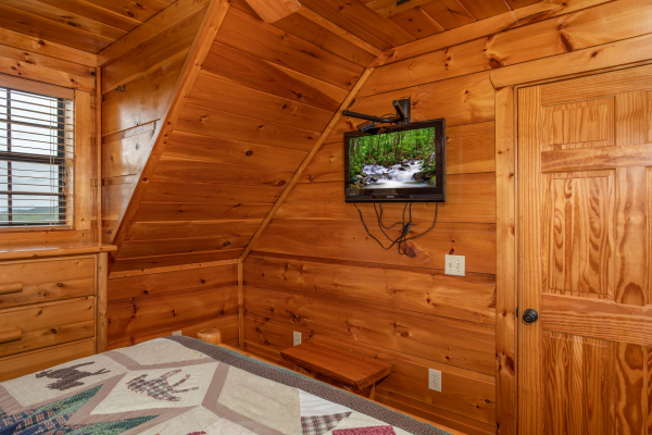 TV in a bedroom at Mountain Bliss, a 2 bedroom cabin rental located in Pigeon Forge