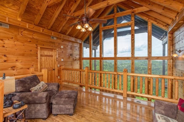 Loft with large windows at Mountain Bliss, a 2 bedroom cabin rental located in Pigeon Forge