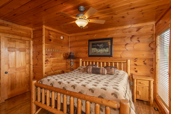 Bedroom with a log bed at Mountain Bliss, a 2 bedroom cabin rental located in Pigeon Forge