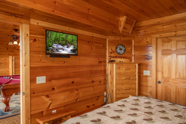 Bedroom with a TV and dresser at Mountain Bliss, a 2 bedroom cabin rental located in Pigeon Forge
