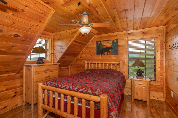 Bedroom with a log bed and dresser at Mountain Bliss, a 2 bedroom cabin rental located in Pigeon Forge