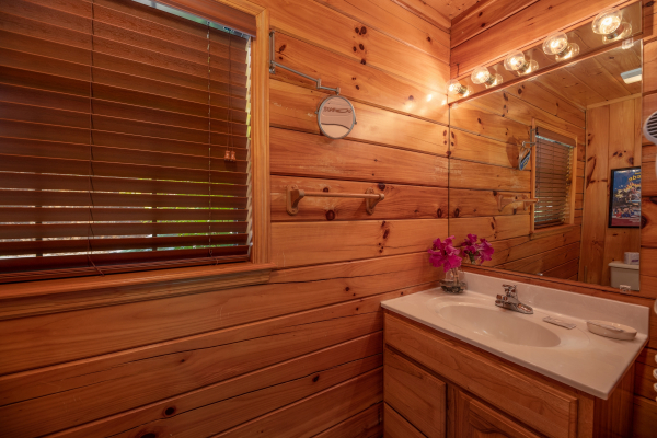 Bathroom vanity at Hello Dolly, a 1 bedroom cabin rental located in Pigeon Forge