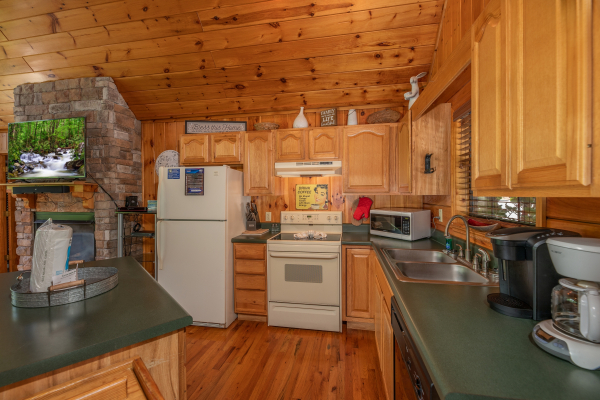 Kitchen at Hello Dolly, a 1 bedroom cabin rental located in Pigeon Forge