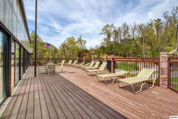 Resort pool deck at Hidden Springs Resort at Hello Dolly, a 1 bedroom cabin rental located in Pigeon Forge