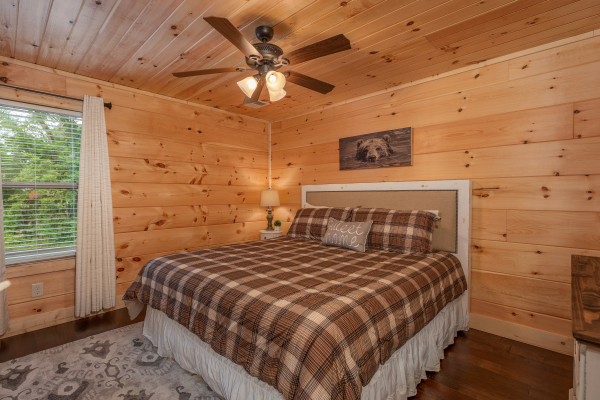 Bedroom with a queen bed at Always Dream'n, a 6 bedroom cabin rental located in Pigeon Forge