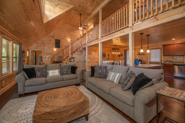 Living room with two sofas at Always Dream'n, a 6 bedroom cabin rental located in Pigeon Forge 