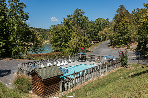 Pool and lake view at Top of the Way, a 2 bedroom cabin rental located in Pigeon Forge