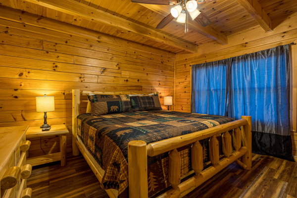 Wood bedframe at Top Of The Way, a 2 bedroom cabin rental located in pigeon forge