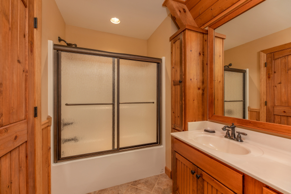 Bathroom with a tub and shower at Mountain Lake Getaway, a 3 bedroom cabin rental located at Douglas Lake