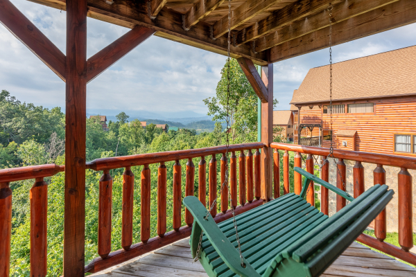 Porch swing at 1 Above the Smokies, a 2 bedroom cabin rental located in Pigeon Forge