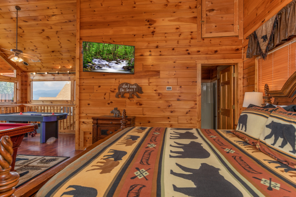 TV and game tables in the loft bedroom at 1 Above the Smokies, a 2 bedroom cabin rental located in Pigeon Forge