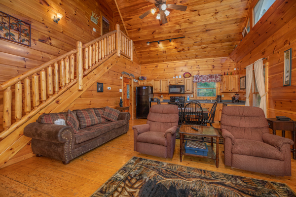 Two recliners and a sofa in the living room at Firefly Ridge, a 2 bedroom cabin rental located in Pigeon Forge
