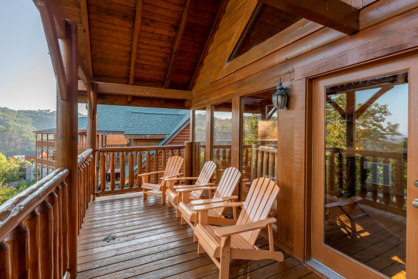 Deck adirondack chairs at Rocky Top Retreat, a 2 bedroom cabin rental located in Pigeon Forge