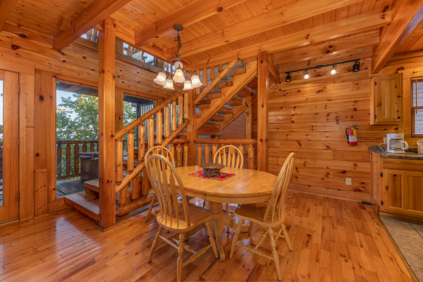 Dining table for four at Rocky Top Retreat, a 2 bedroom cabin rental located in Pigeon Forge