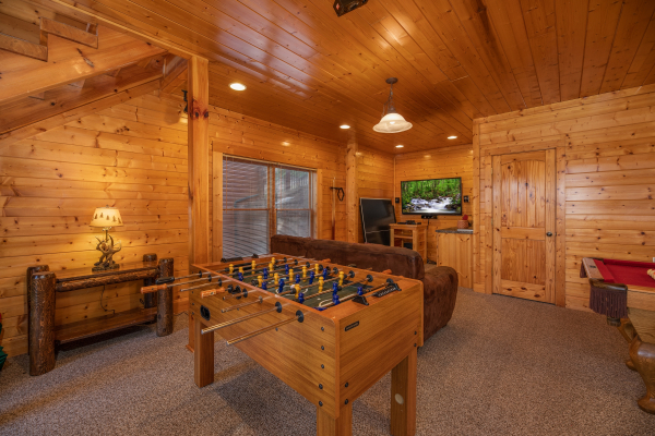 Foosball table in the game room at Rocky Top Retreat, a 2 bedroom cabin rental located in Pigeon Forge