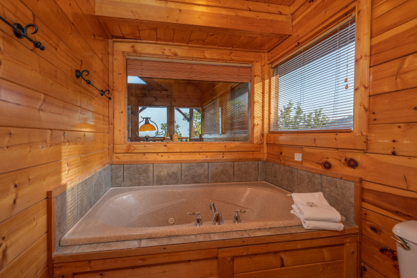 Jacuzzi in a bathroom at Rocky Top Retreat, a 2 bedroom cabin rental located in Pigeon Forge