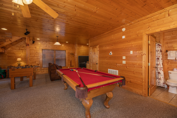 Pool table in the game room at Rocky Top Retreat, a 2 bedroom cabin rental located in Pigeon Forge