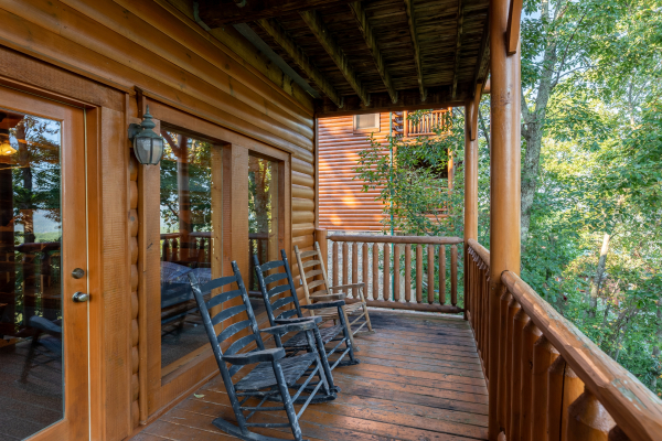 Lower level rocking chairs at Rocky Top Retreat, a 2 bedroom cabin rental located in Pigeon Forge